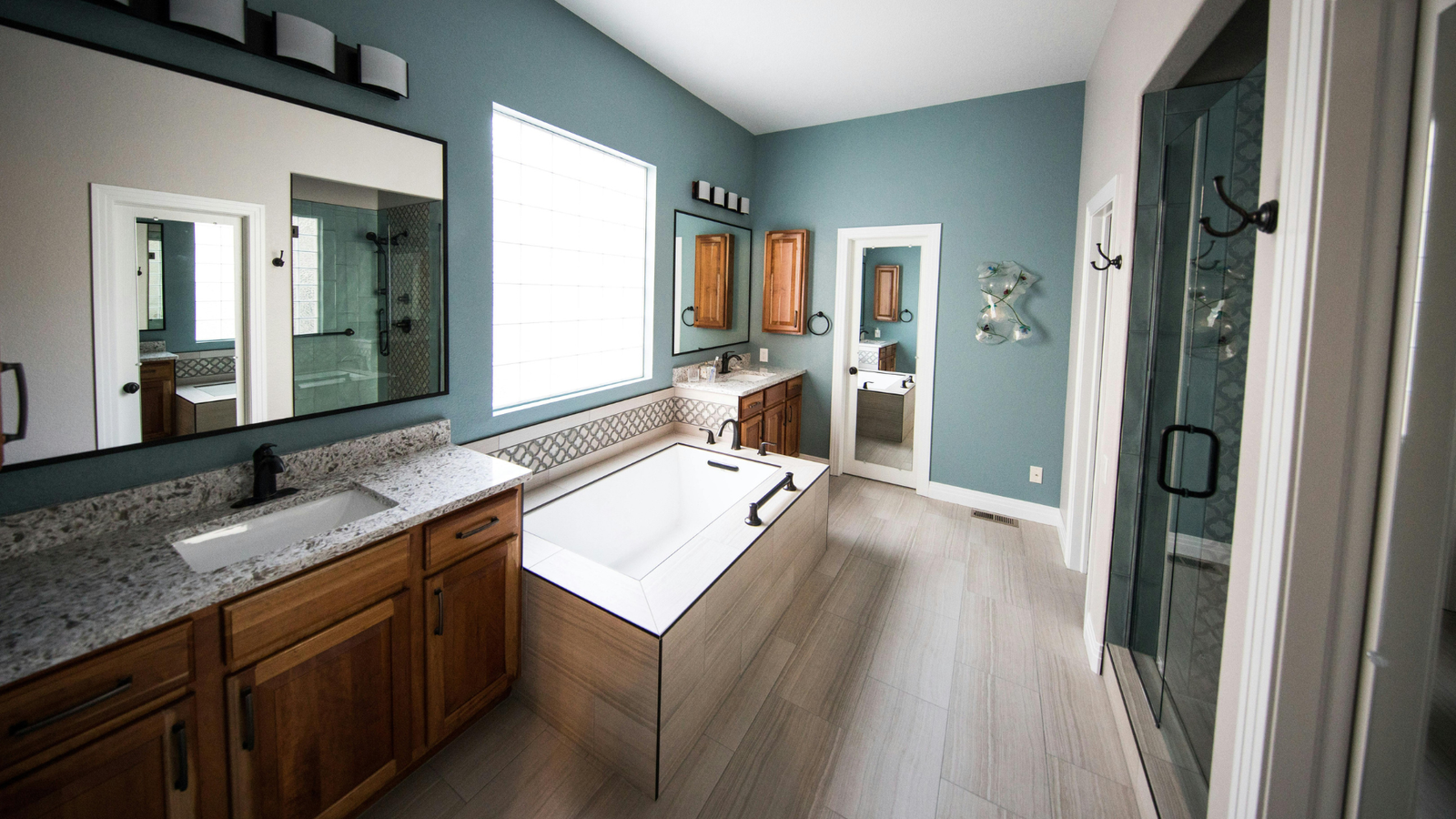 Modern bathroom remodel in a Dallas home with custom tile and lighting